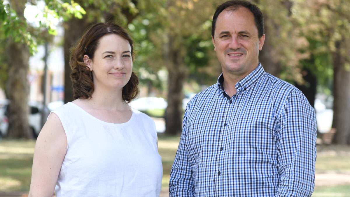 Two community representatives outdoors